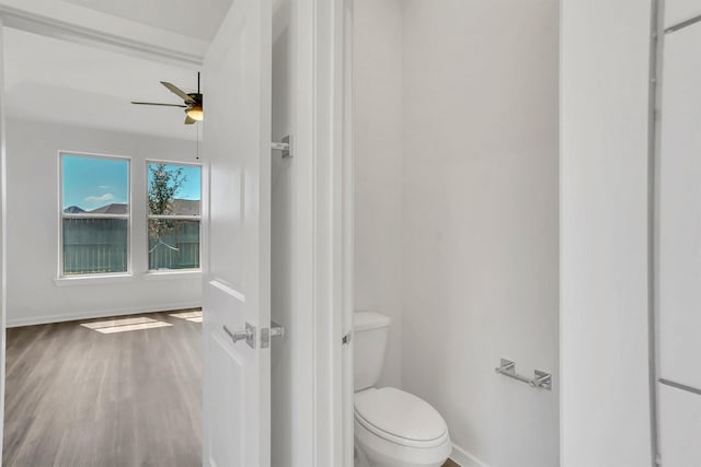 bathroom featuring hardwood / wood-style floors and toilet