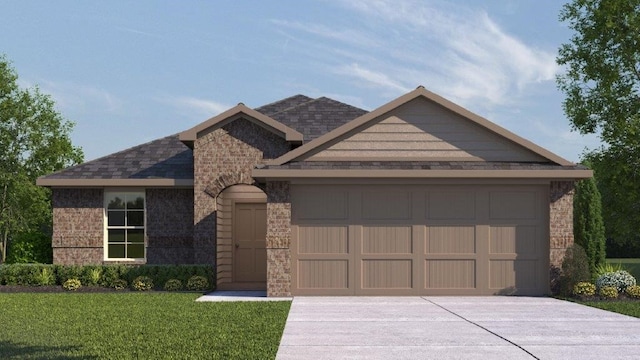 view of front of home featuring a garage and a front lawn