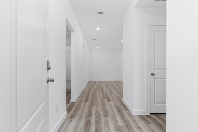 hall with light wood-type flooring