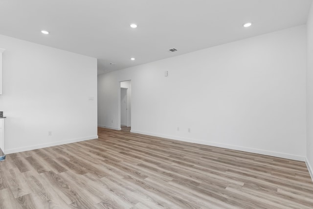 spare room featuring light hardwood / wood-style flooring