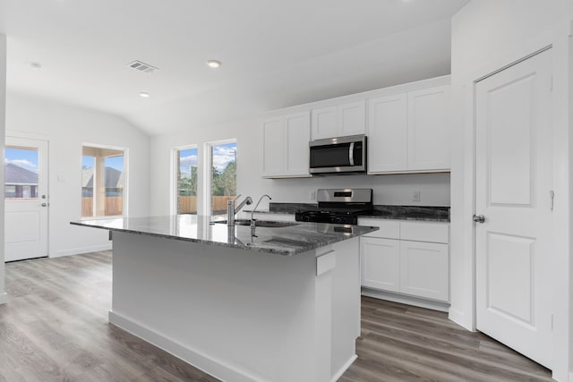 kitchen with white cabinetry, sink, a kitchen island with sink, and appliances with stainless steel finishes