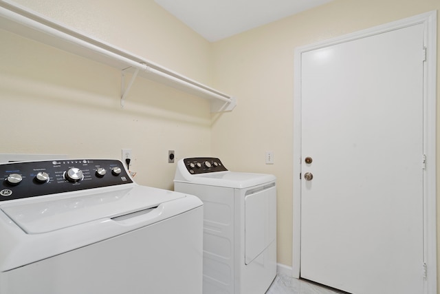 clothes washing area featuring washing machine and dryer