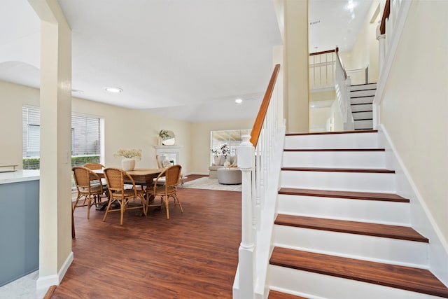 stairs with hardwood / wood-style floors