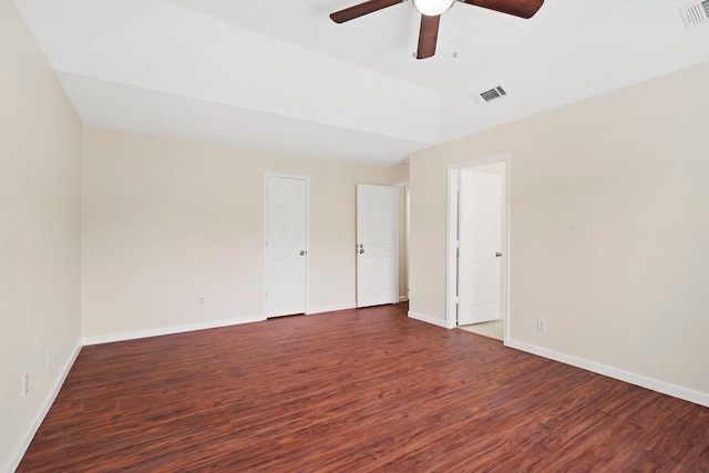 unfurnished room with ceiling fan and dark wood-type flooring