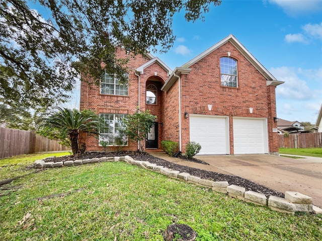 view of property with a front lawn and a garage