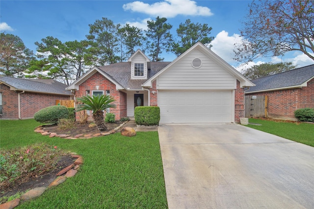 view of front of house with a garage and a front lawn