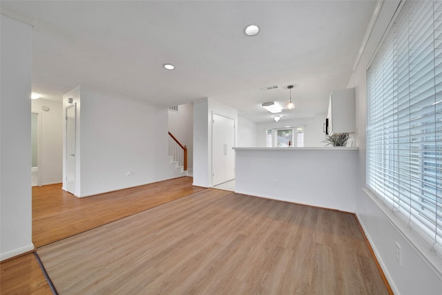 unfurnished living room with light hardwood / wood-style floors