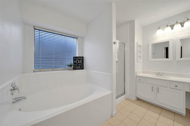 bathroom with shower with separate bathtub, vanity, and tile patterned floors