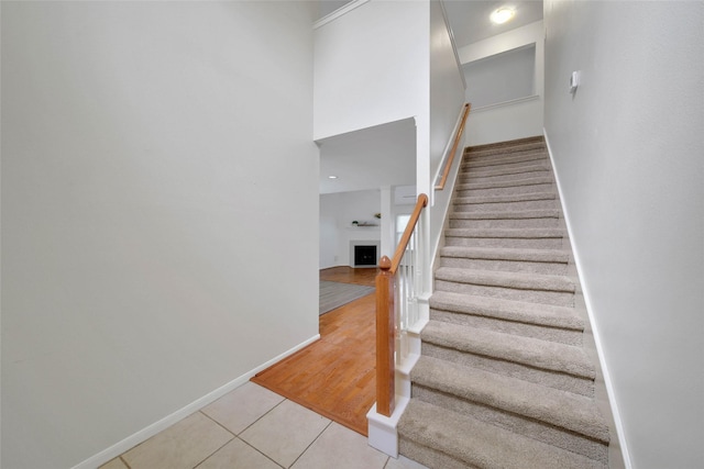 stairway featuring tile patterned floors