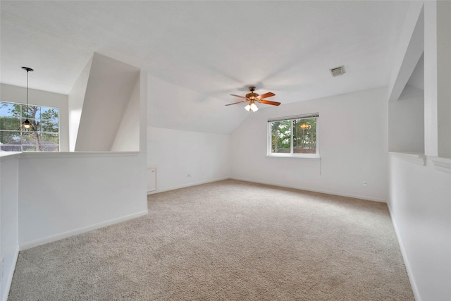 bonus room featuring ceiling fan, carpet, and lofted ceiling