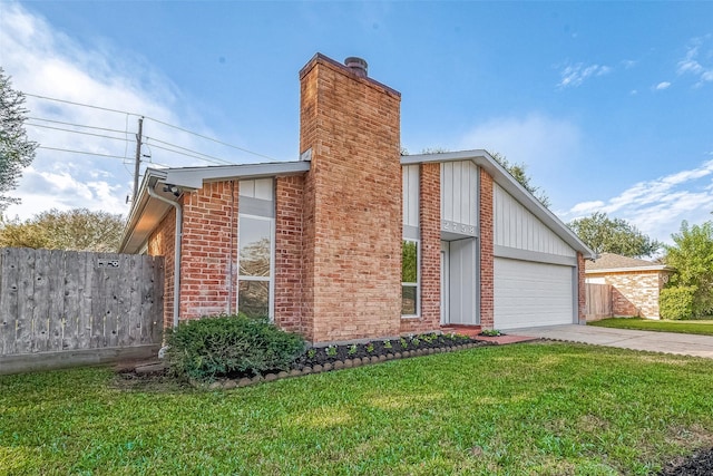 view of front of property with a garage and a front lawn