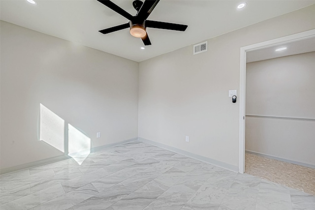 spare room featuring ceiling fan