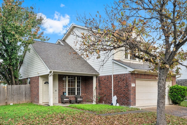 view of front of house featuring a front yard and a garage