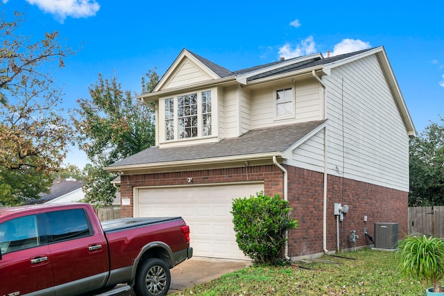 view of property exterior featuring a garage and central air condition unit