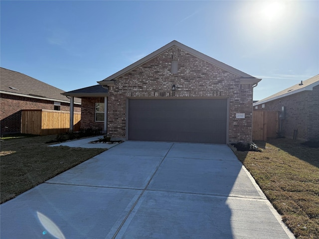 single story home featuring driveway, a garage, fence, and brick siding