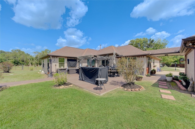 back of house featuring a yard and a patio area