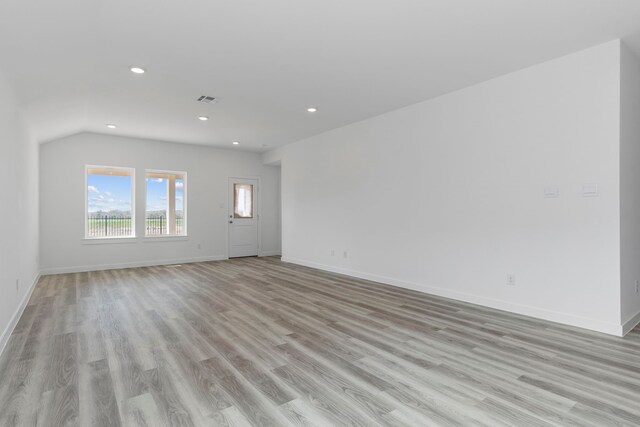 unfurnished living room with light wood-type flooring