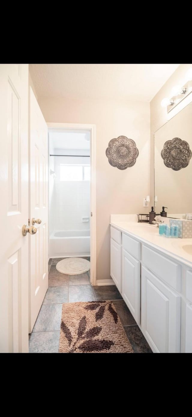 bathroom with vanity and shower / bathtub combination