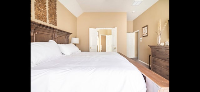 bedroom with vaulted ceiling