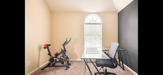 office area with light colored carpet and lofted ceiling