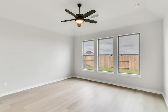 unfurnished room with ceiling fan and light wood-type flooring