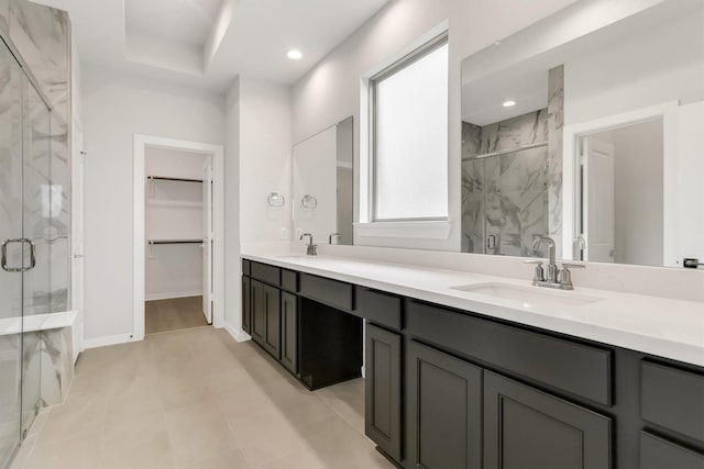 bathroom featuring vanity and a shower with shower door