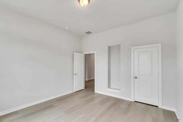 unfurnished bedroom featuring light hardwood / wood-style floors