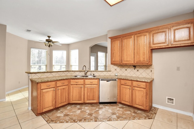 kitchen with dishwasher, sink, ceiling fan, decorative backsplash, and light tile patterned floors