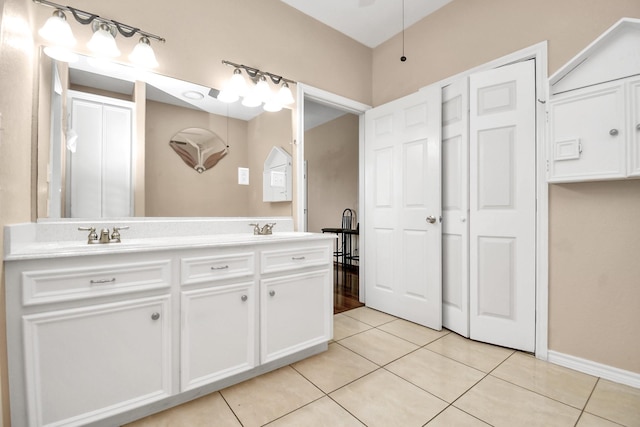 bathroom featuring tile patterned flooring and vanity