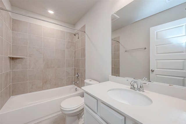 full bathroom featuring vanity, toilet, and tiled shower / bath