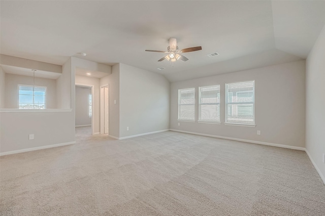 unfurnished room with ceiling fan, light colored carpet, and vaulted ceiling