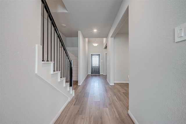 entrance foyer with light hardwood / wood-style flooring