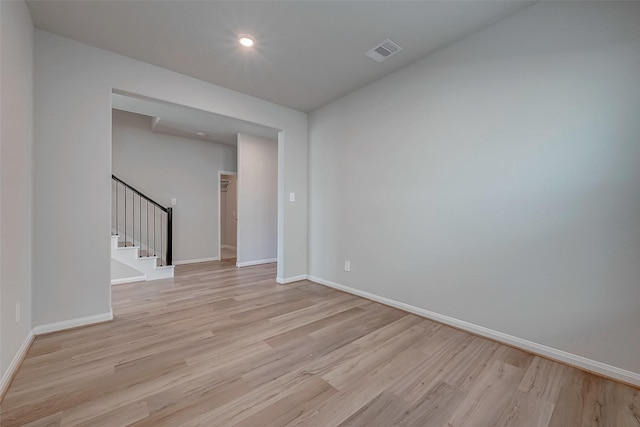 spare room featuring light hardwood / wood-style flooring