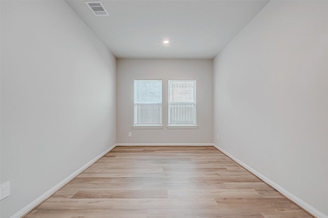 unfurnished room featuring light hardwood / wood-style floors