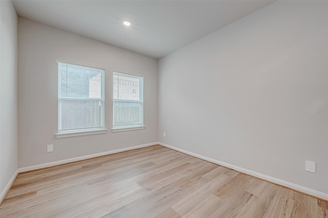 spare room with light wood-type flooring