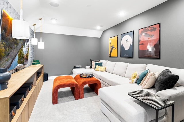 carpeted living room with vaulted ceiling