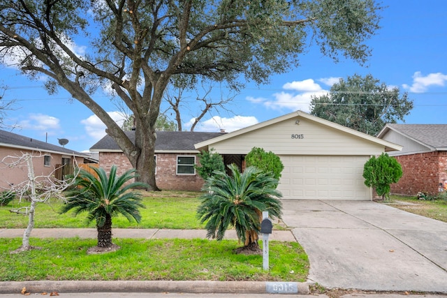 single story home with a garage and a front lawn