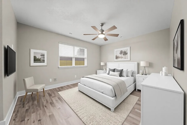 bedroom with wood-type flooring and ceiling fan