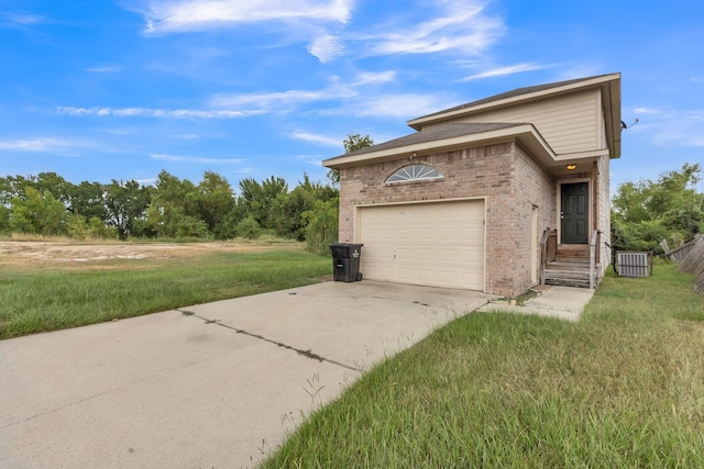 view of front of house with a front yard and a garage