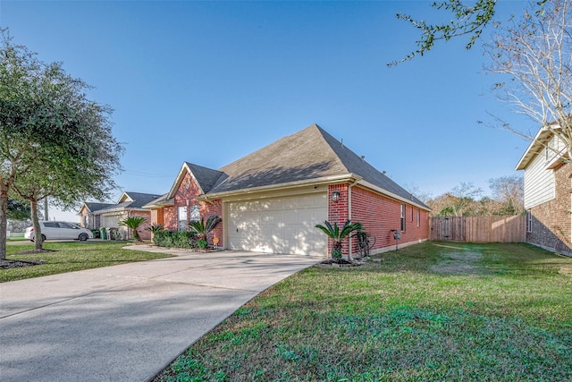 view of front facade with a front yard and a garage