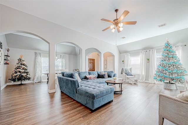 living room with ceiling fan and hardwood / wood-style floors