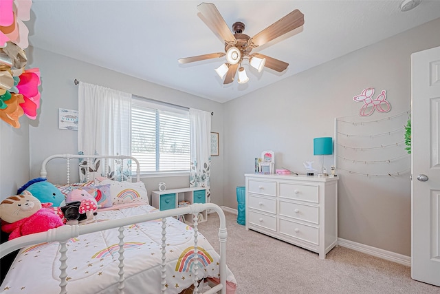 bedroom with ceiling fan and light colored carpet