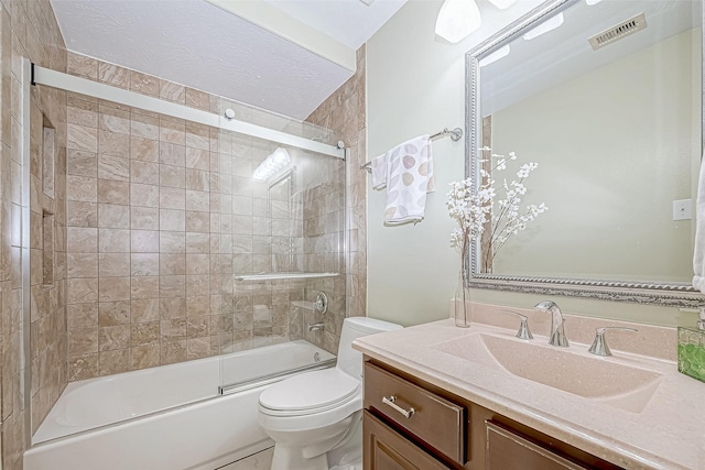 full bathroom with toilet, vanity, and combined bath / shower with glass door