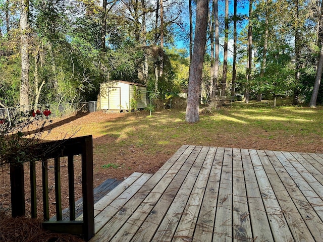 wooden deck with a yard and a shed