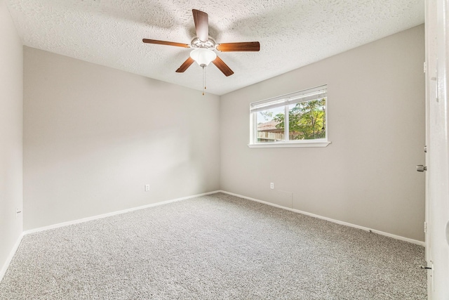 spare room featuring ceiling fan, carpet floors, and a textured ceiling