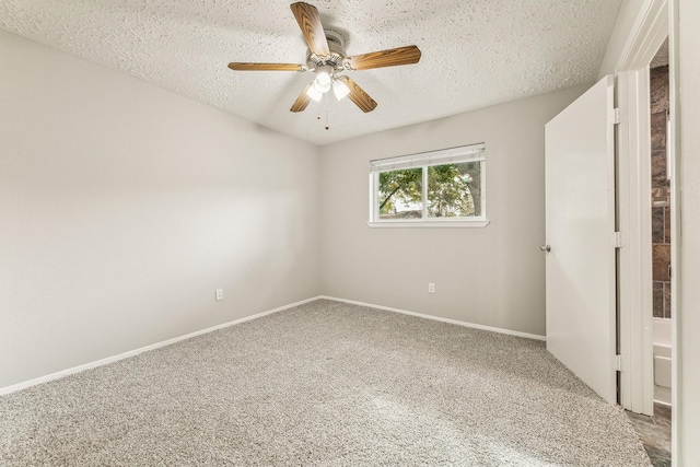 unfurnished bedroom featuring ceiling fan, carpet floors, and a textured ceiling