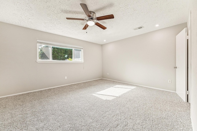 unfurnished room with carpet flooring, a textured ceiling, and ceiling fan