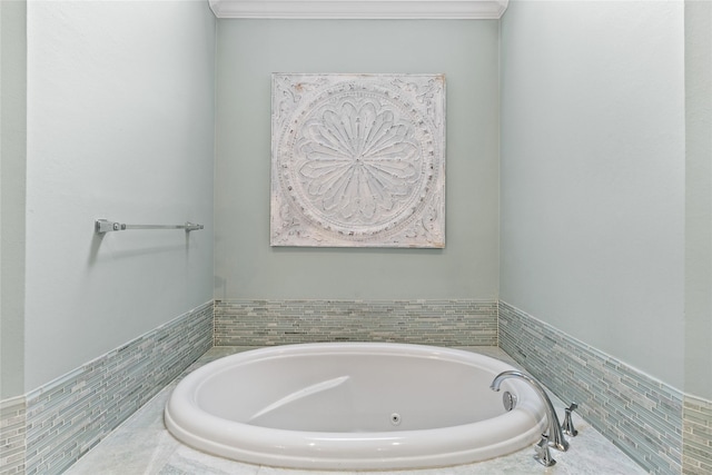 bathroom featuring a bathing tub and crown molding