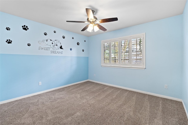 carpeted empty room with vaulted ceiling and ceiling fan