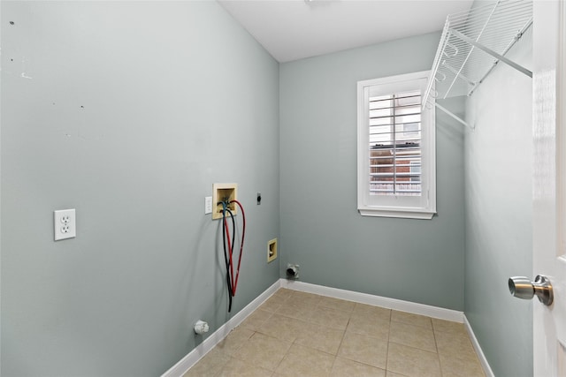 laundry area with hookup for a washing machine, light tile patterned floors, hookup for a gas dryer, and electric dryer hookup